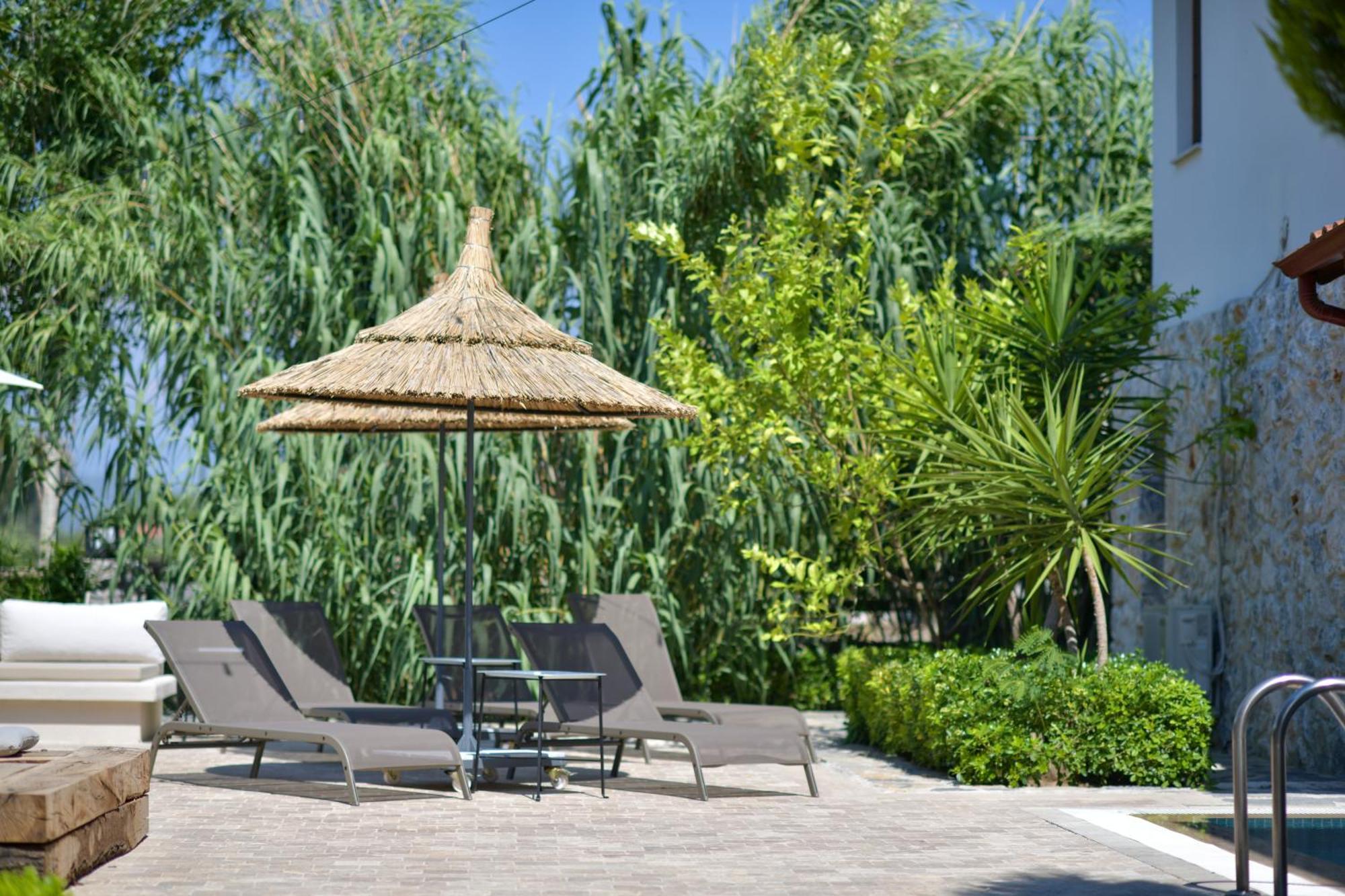Okapi Suites Ula 外观 照片